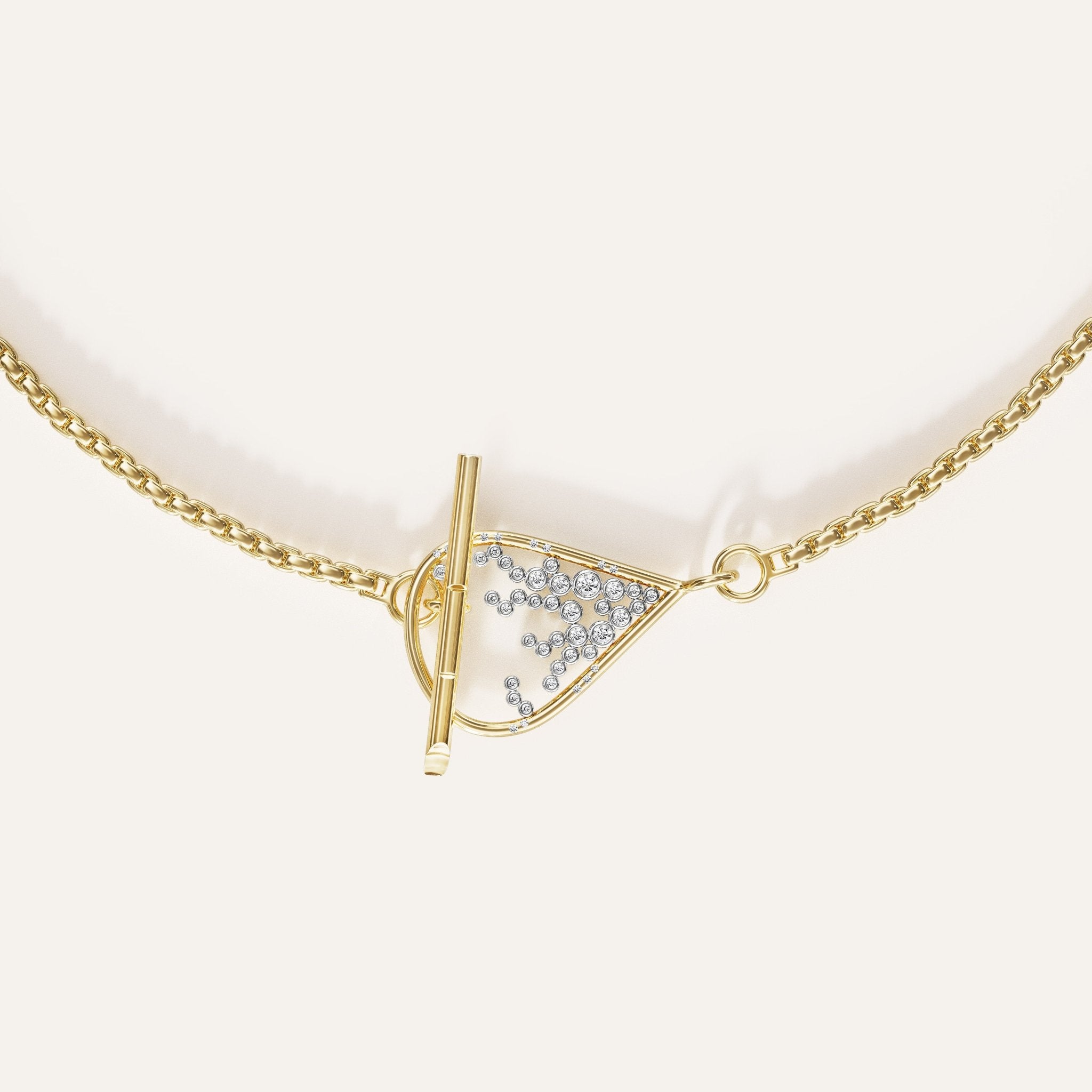 Gold necklace with a triangular pendant on a white background
