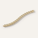 Gold bracelet with diamond accents on a white background