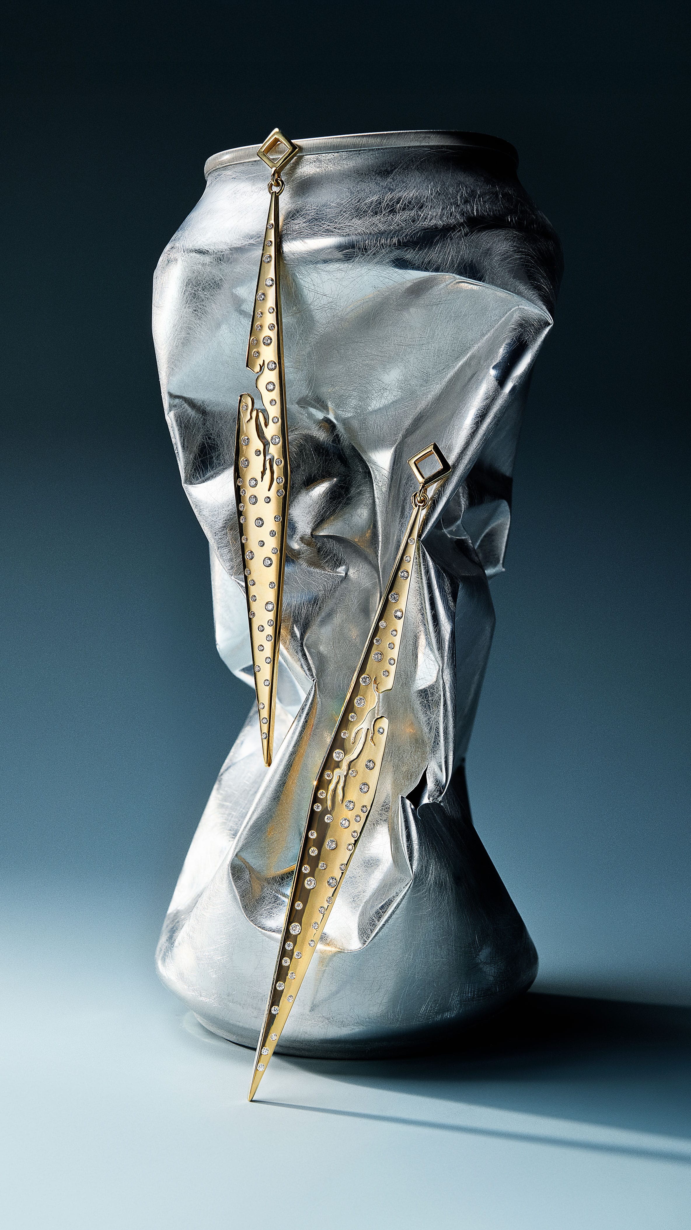 stylized presentation of gold earrings