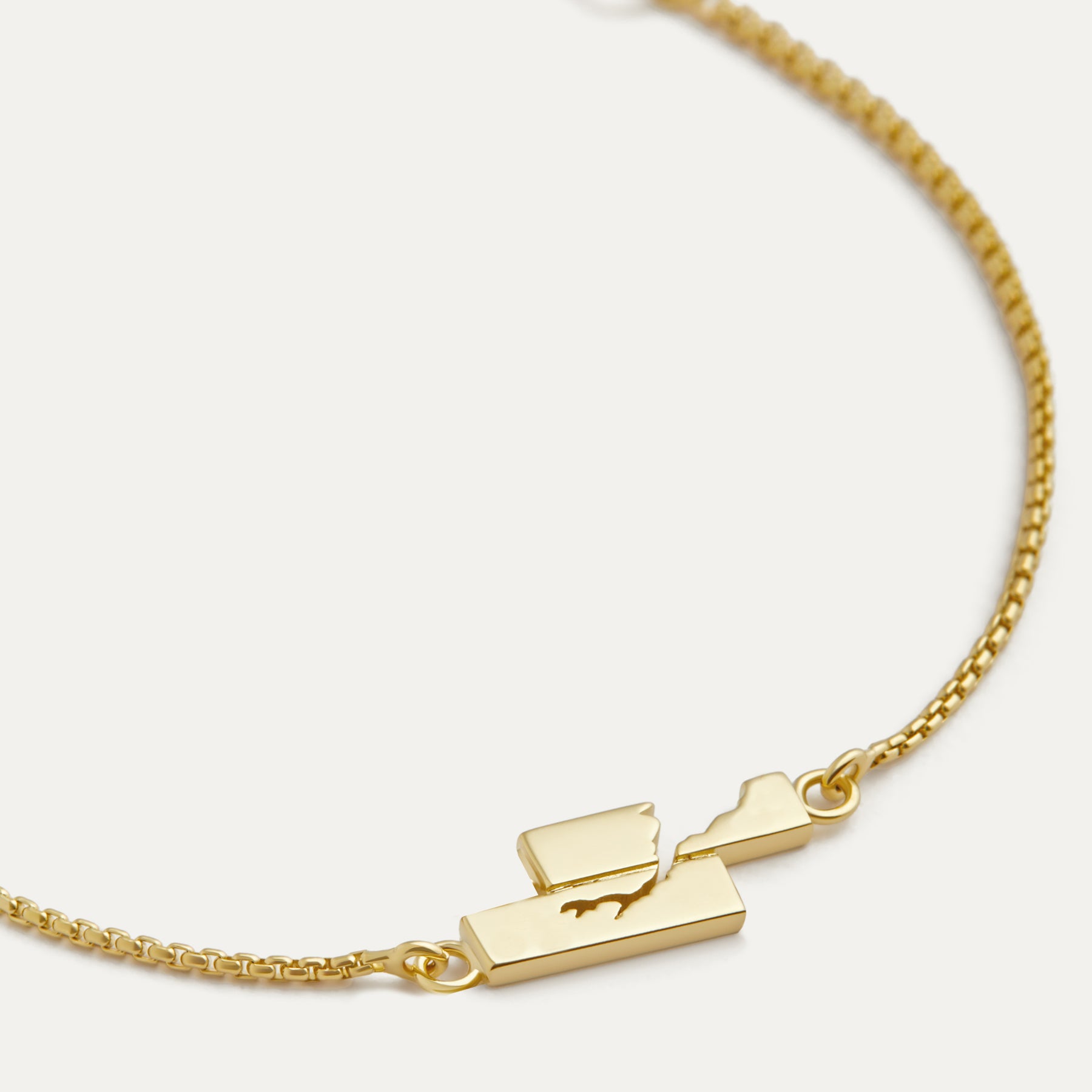 A 14k gold chain bracelet with a lobster clasp, displayed against a white background.