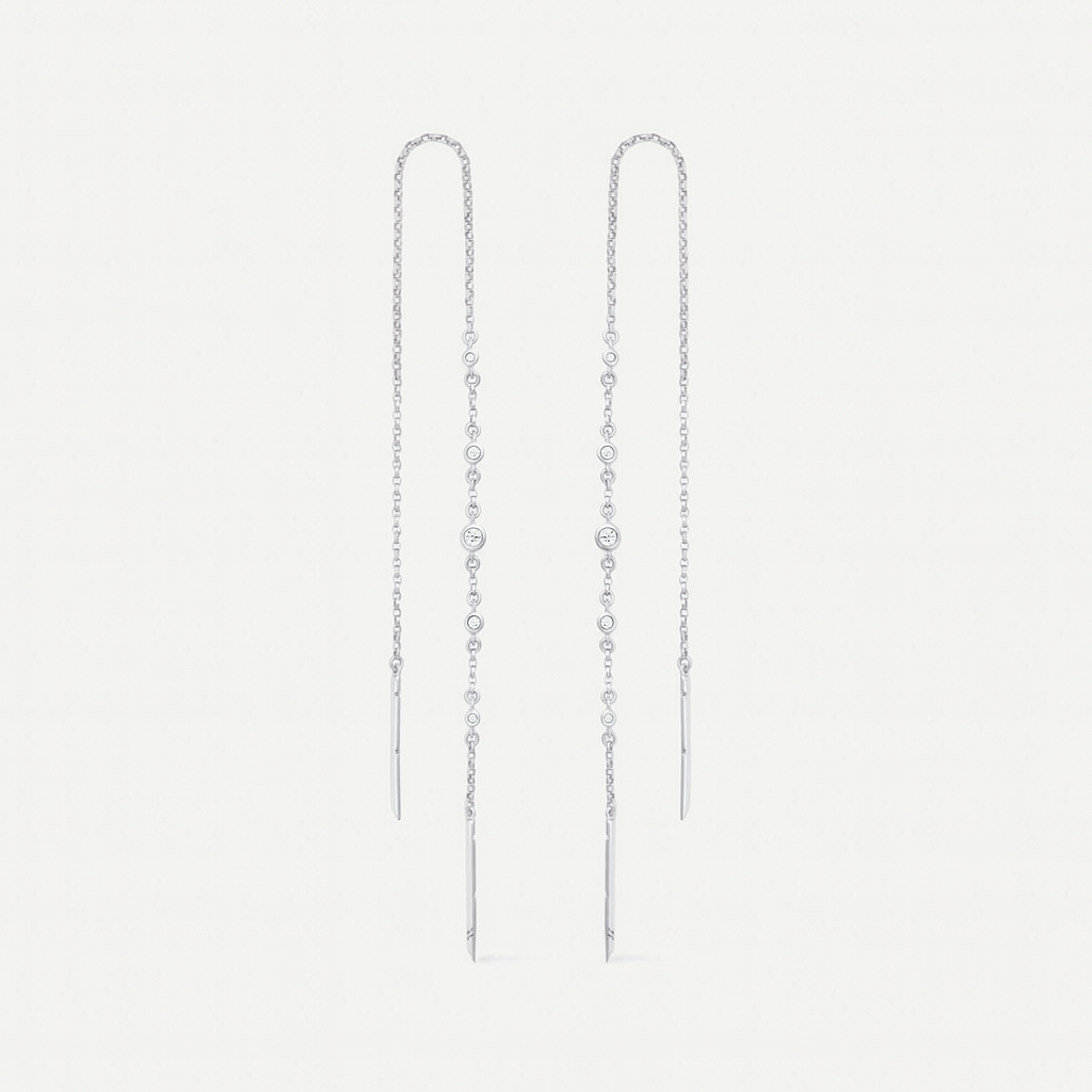 Pair of silver chain earrings on a light gray background