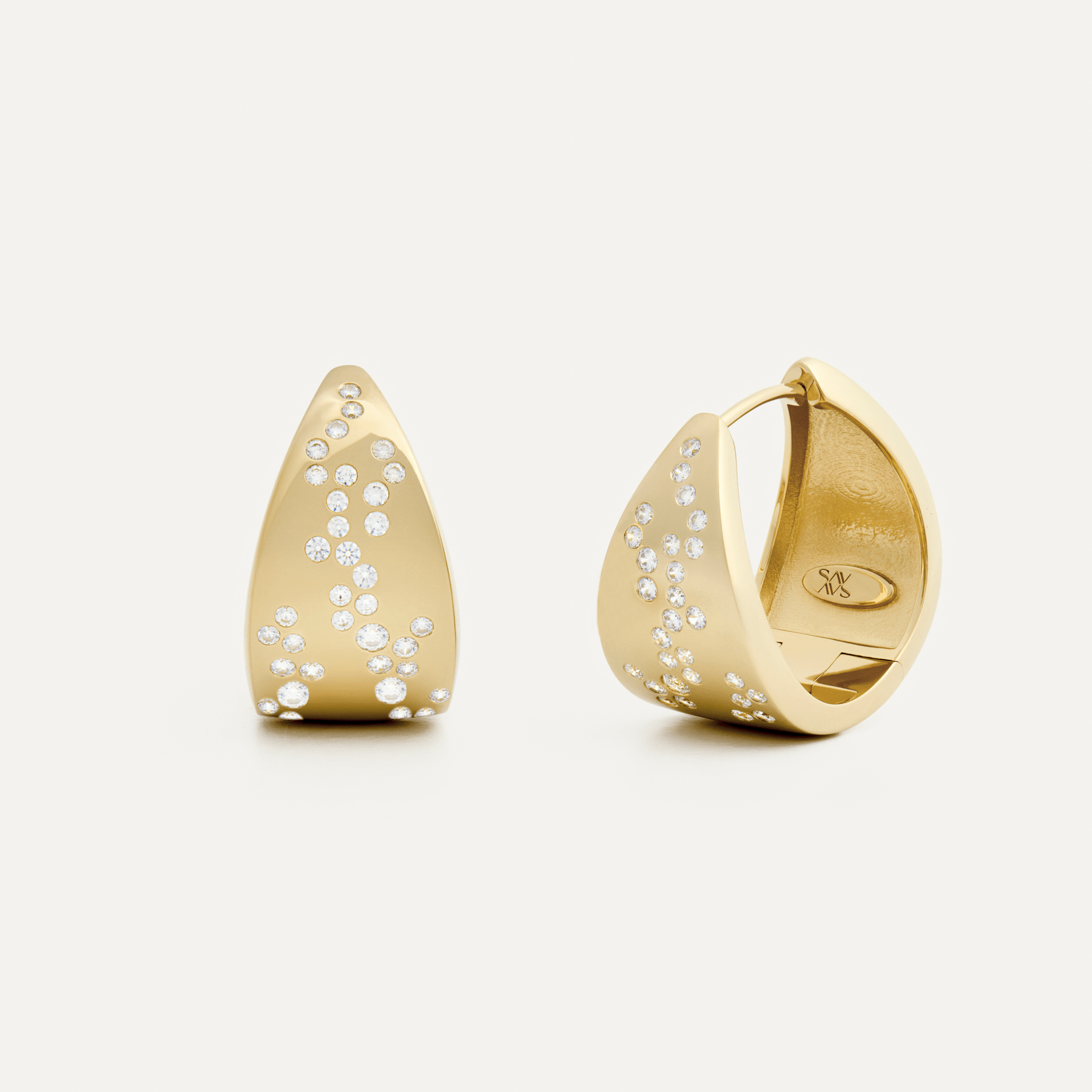 A pair of 14k gold triangle-shaped hoop earrings with diamonds