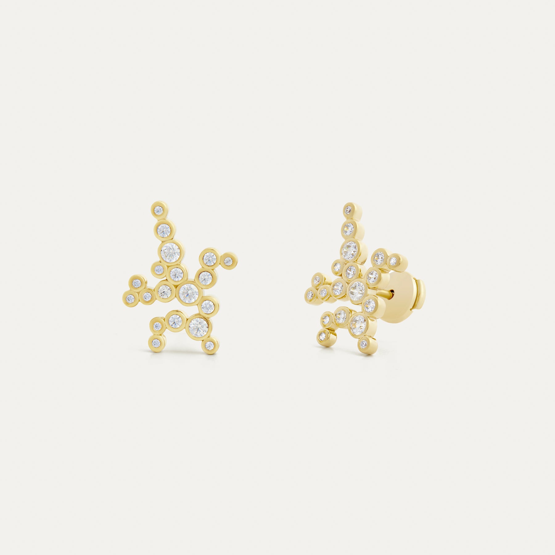 A pair of large gold stud earrings with lab-grown diamonds, featuring a cluster design.