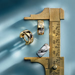 Earrings with adjustable measuring tool