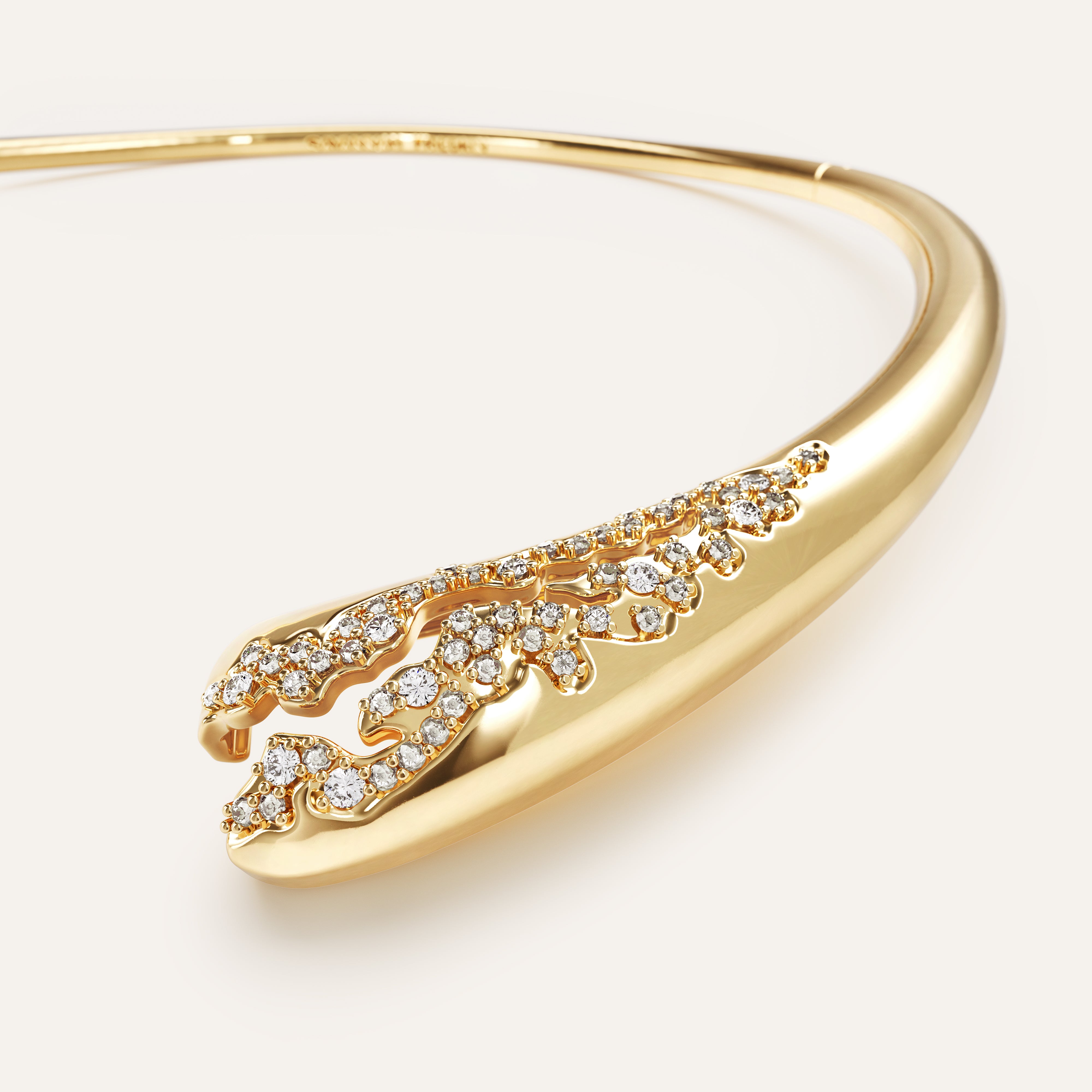 Gold bracelet with diamond accents on a light background