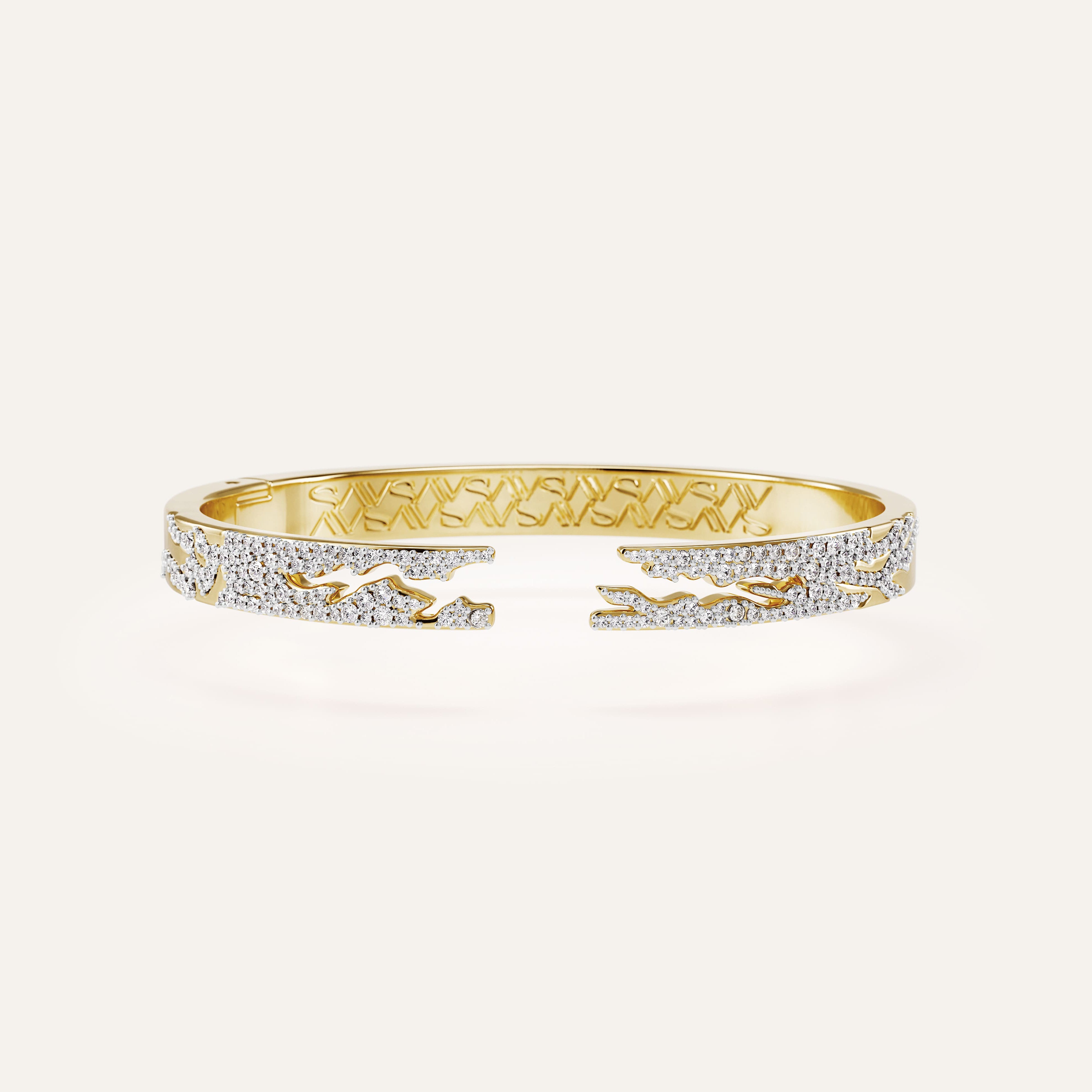 Gold bracelet with diamond accents on a white background
