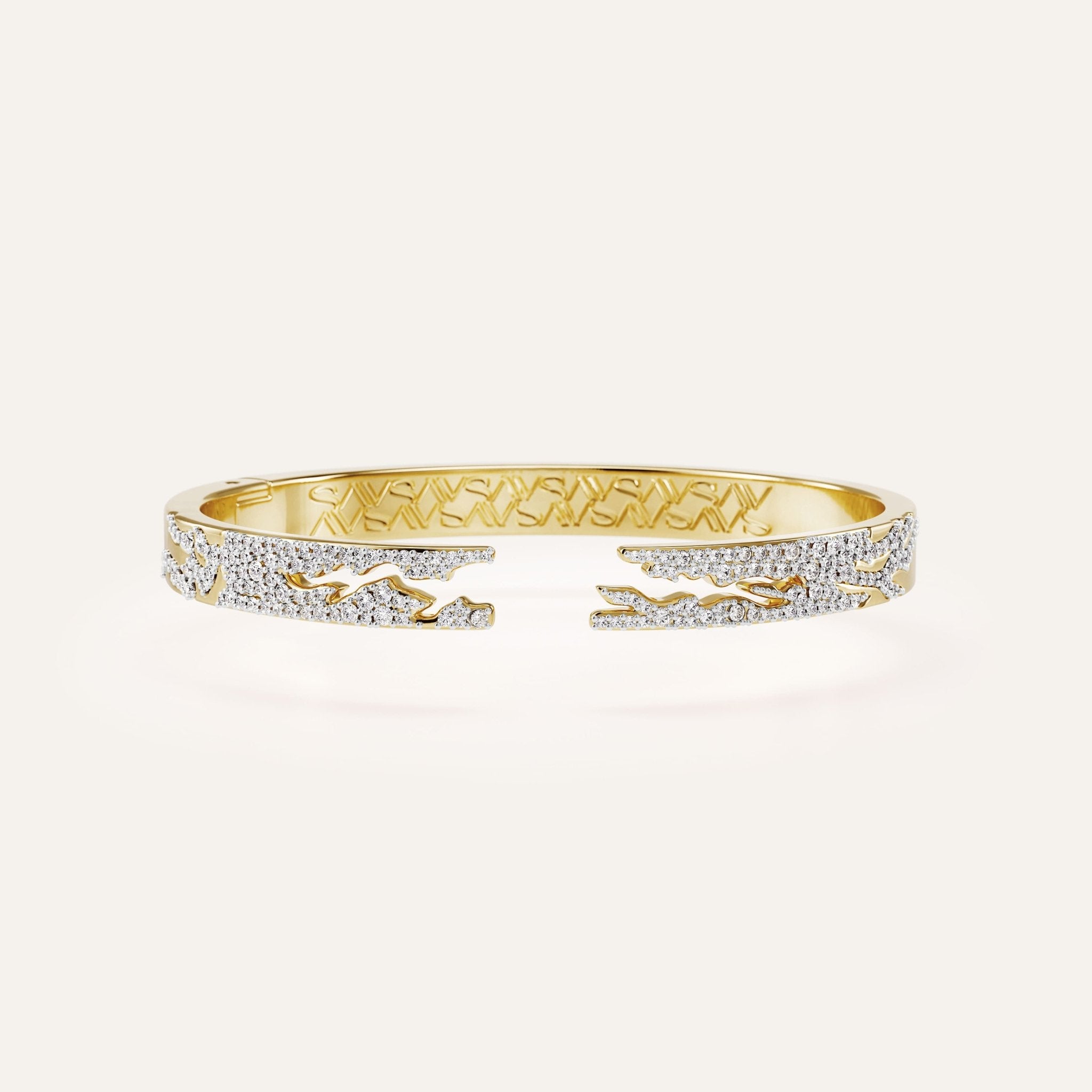 Gold bracelet with diamond accents on a white background