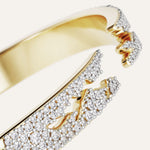 Gold and diamond bracelet on a white background