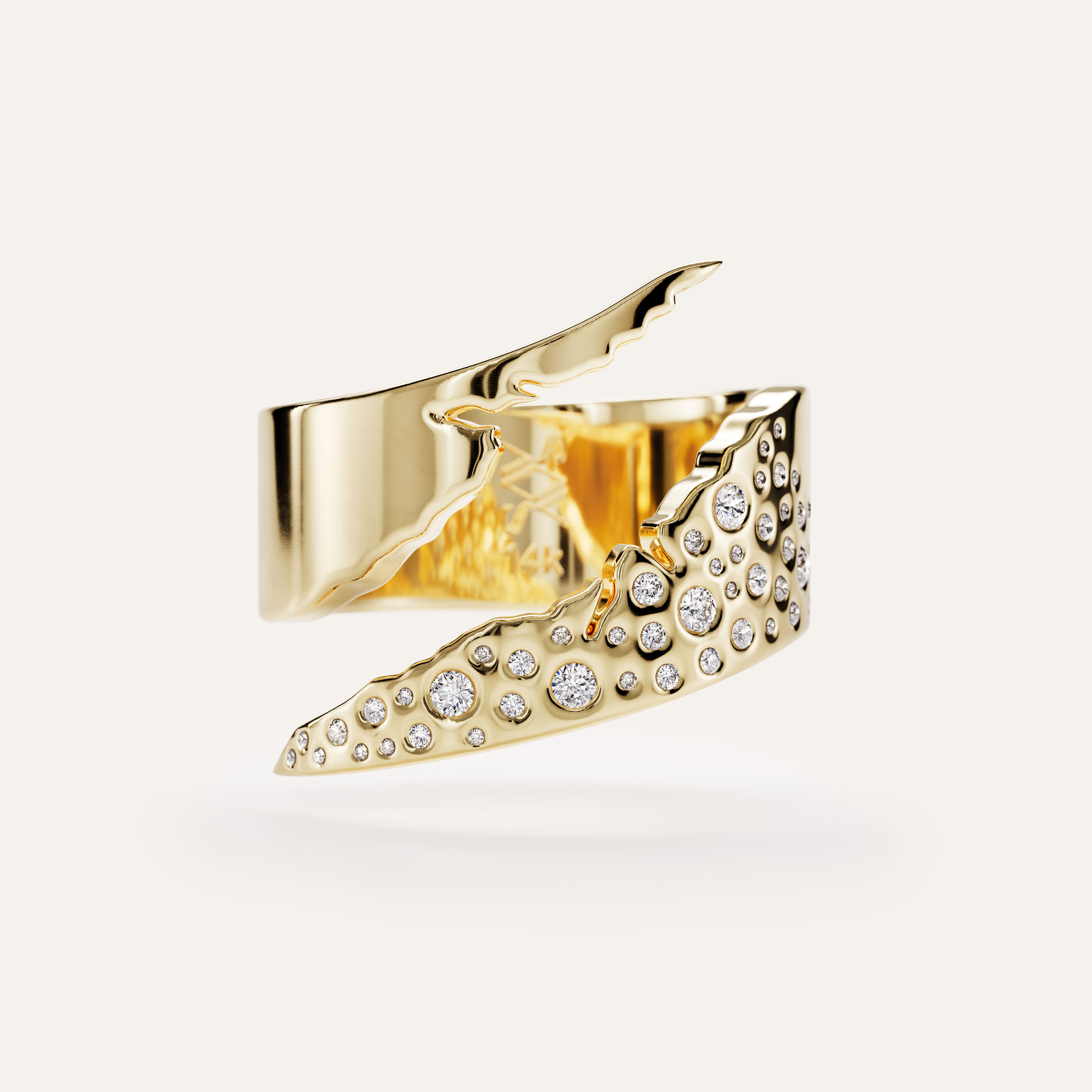 Gold ring with diamond accents on a light gray background