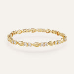 Gold bracelet with diamond accents on a light background
