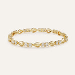 Gold bracelet with diamond accents on a light beige background