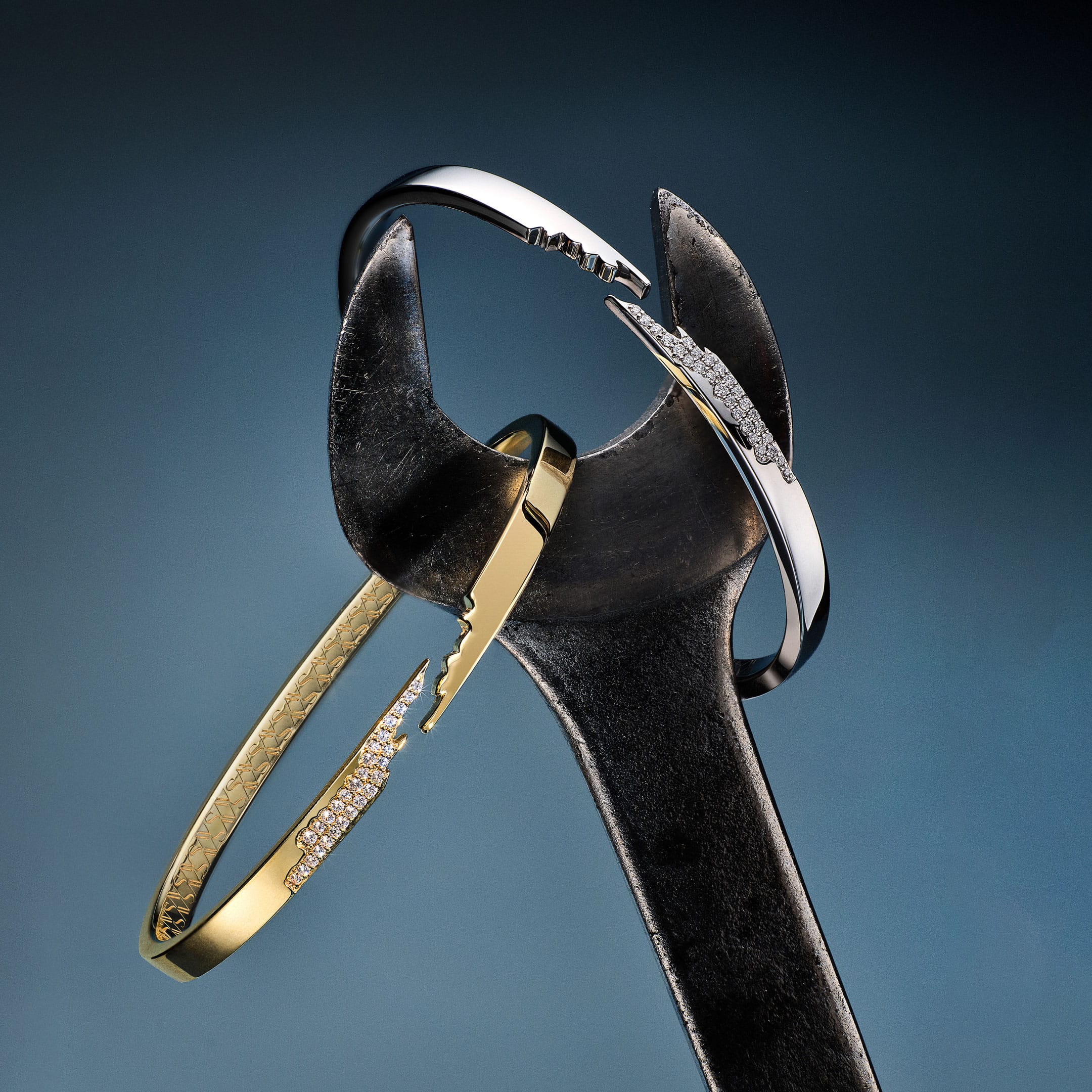 A gold and silver ring on a wrench