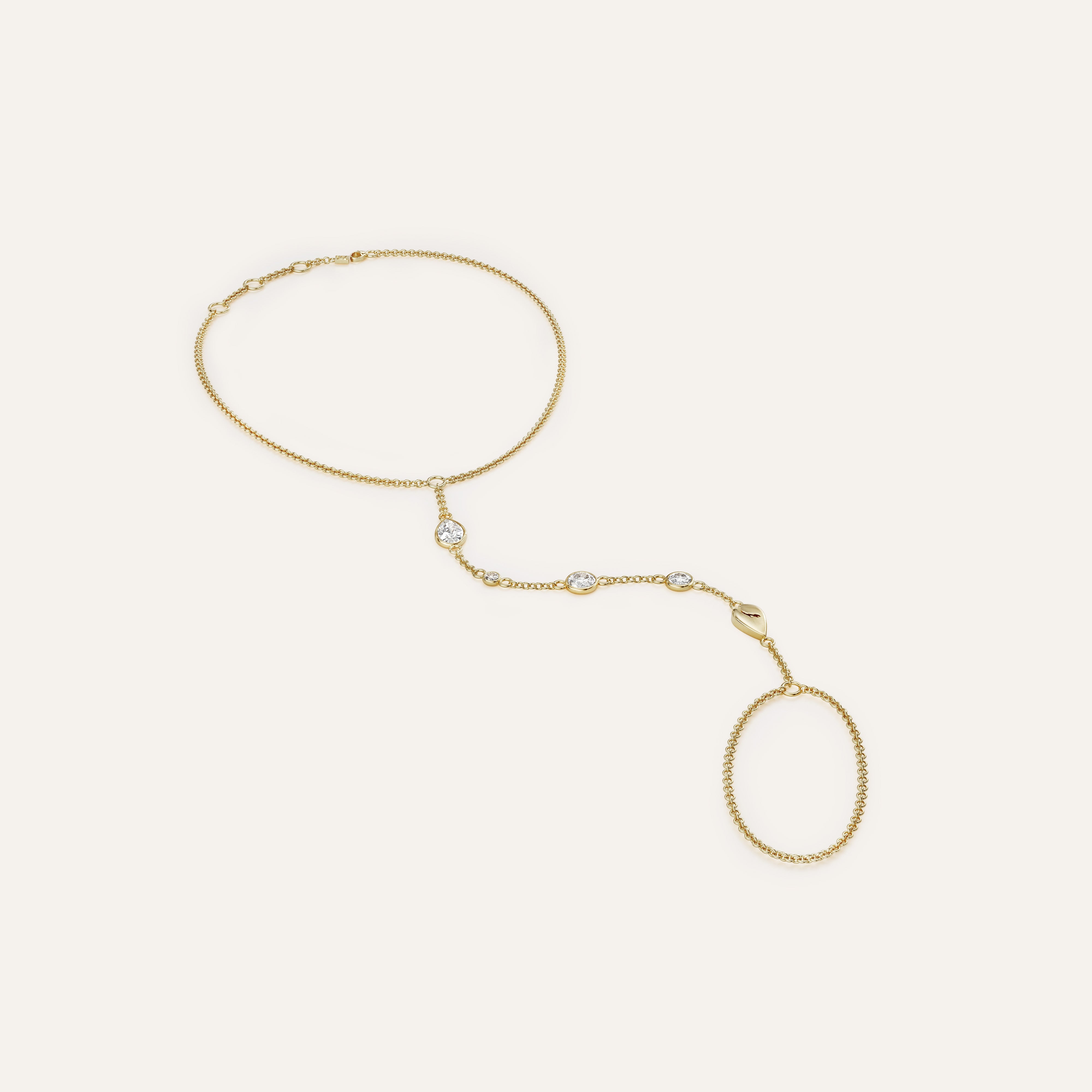 Gold necklace with oval pendants on a light beige background