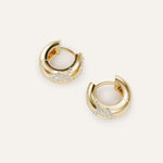 Gold hoop earrings with embedded stones on a white background