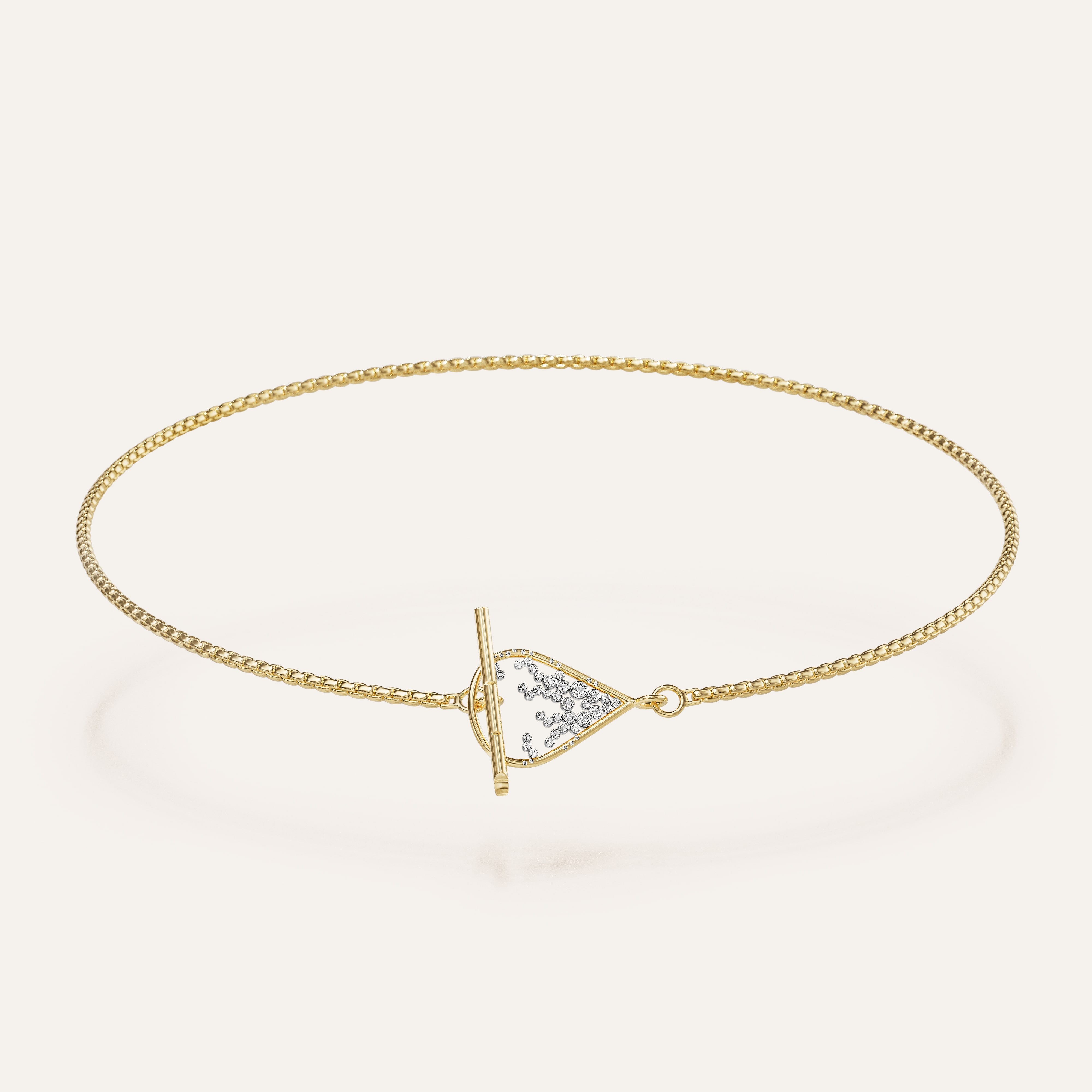 Gold bracelet with a triangle-shaped clasp on a light beige background