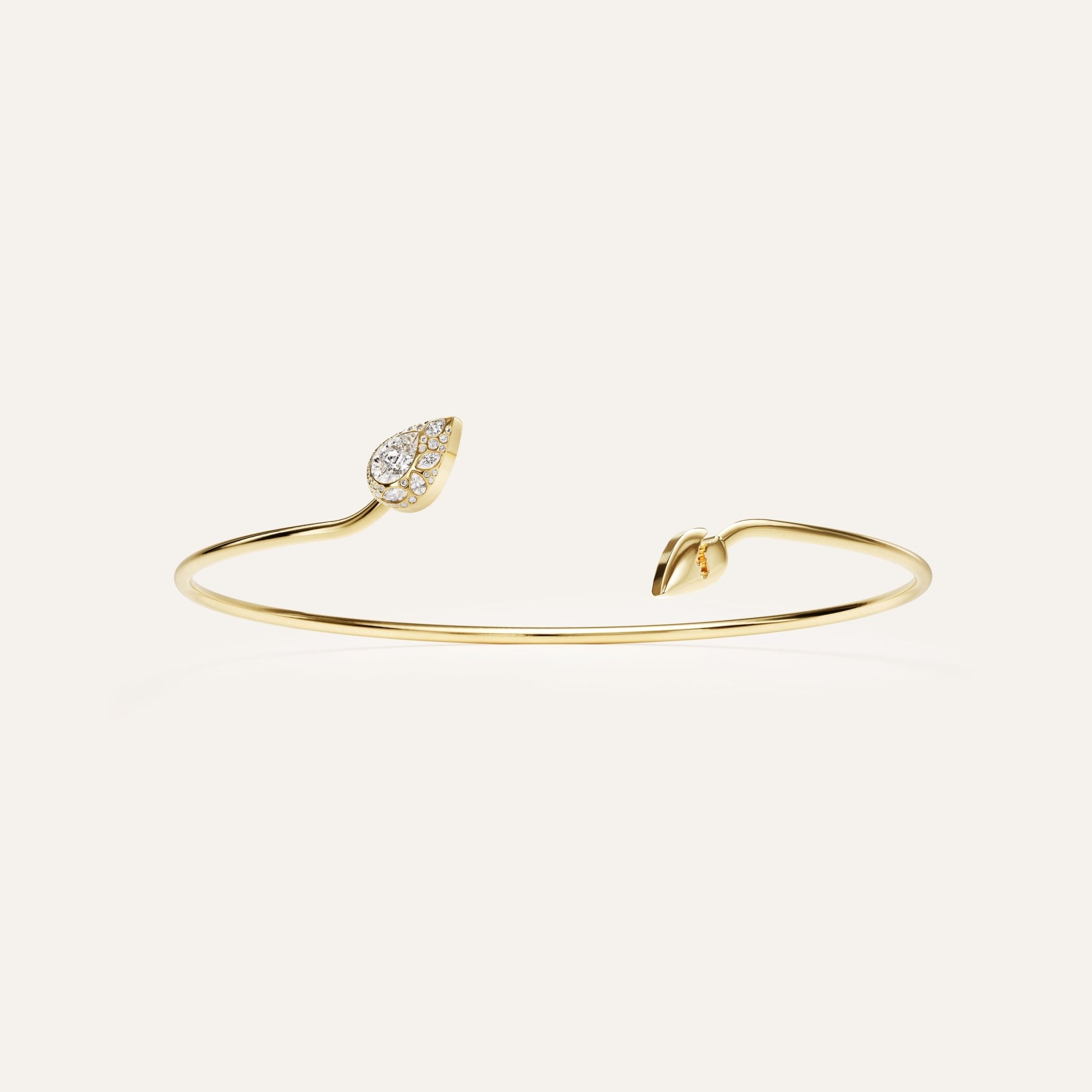 Gold bracelet with leaf designs on a white background
