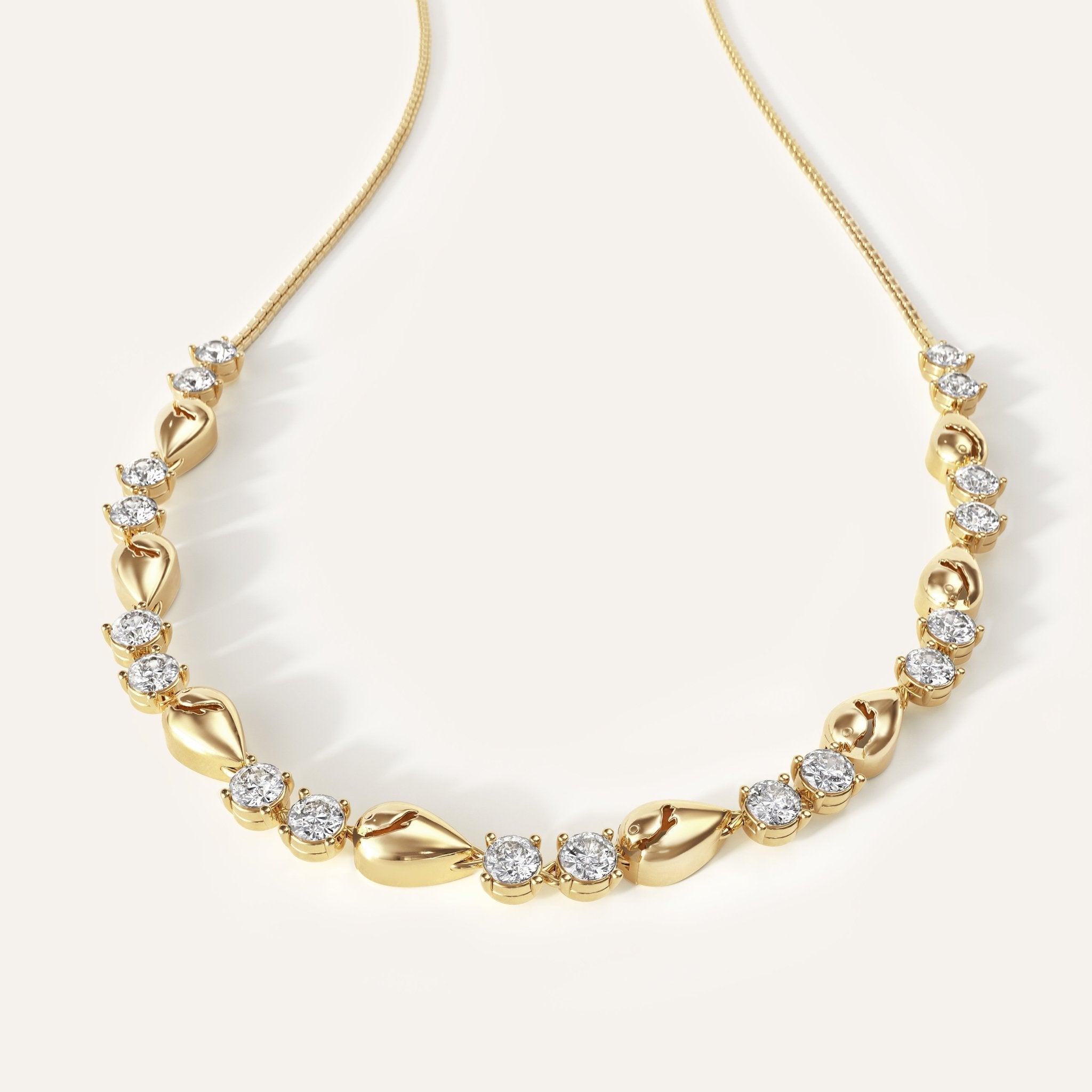 Gold necklace with diamond accents on a white background