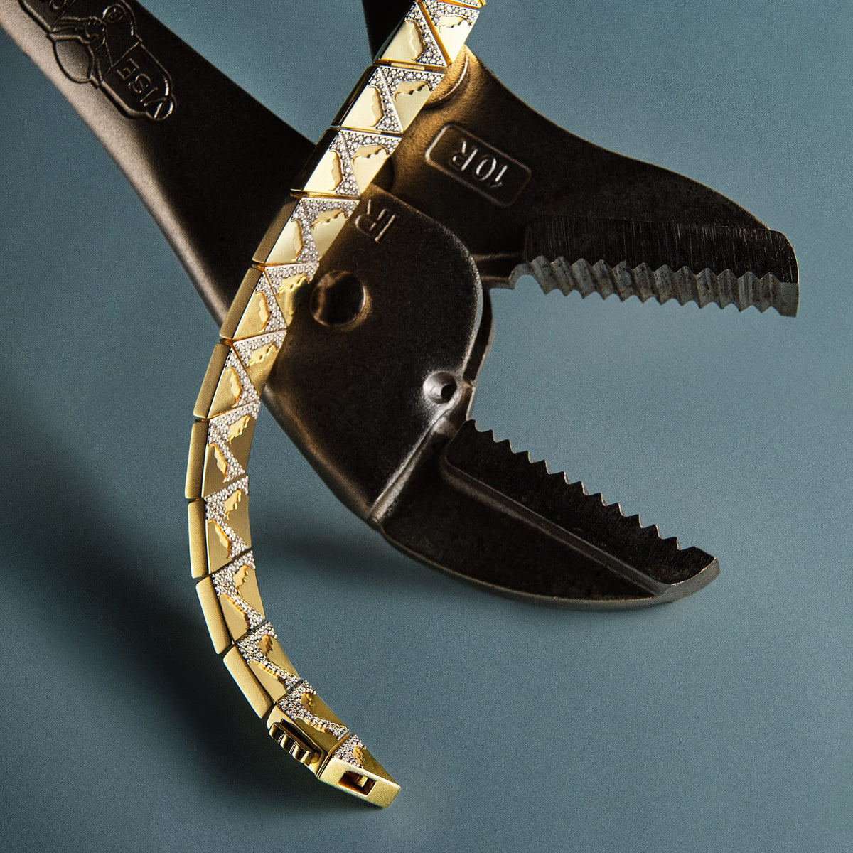 This image features a close-up view of a stylish, broken wide triangle bracelet. The bracelet displays an elegant pattern with gold-colored triangles arranged in a chain-link design, offering a sleek and modern look.